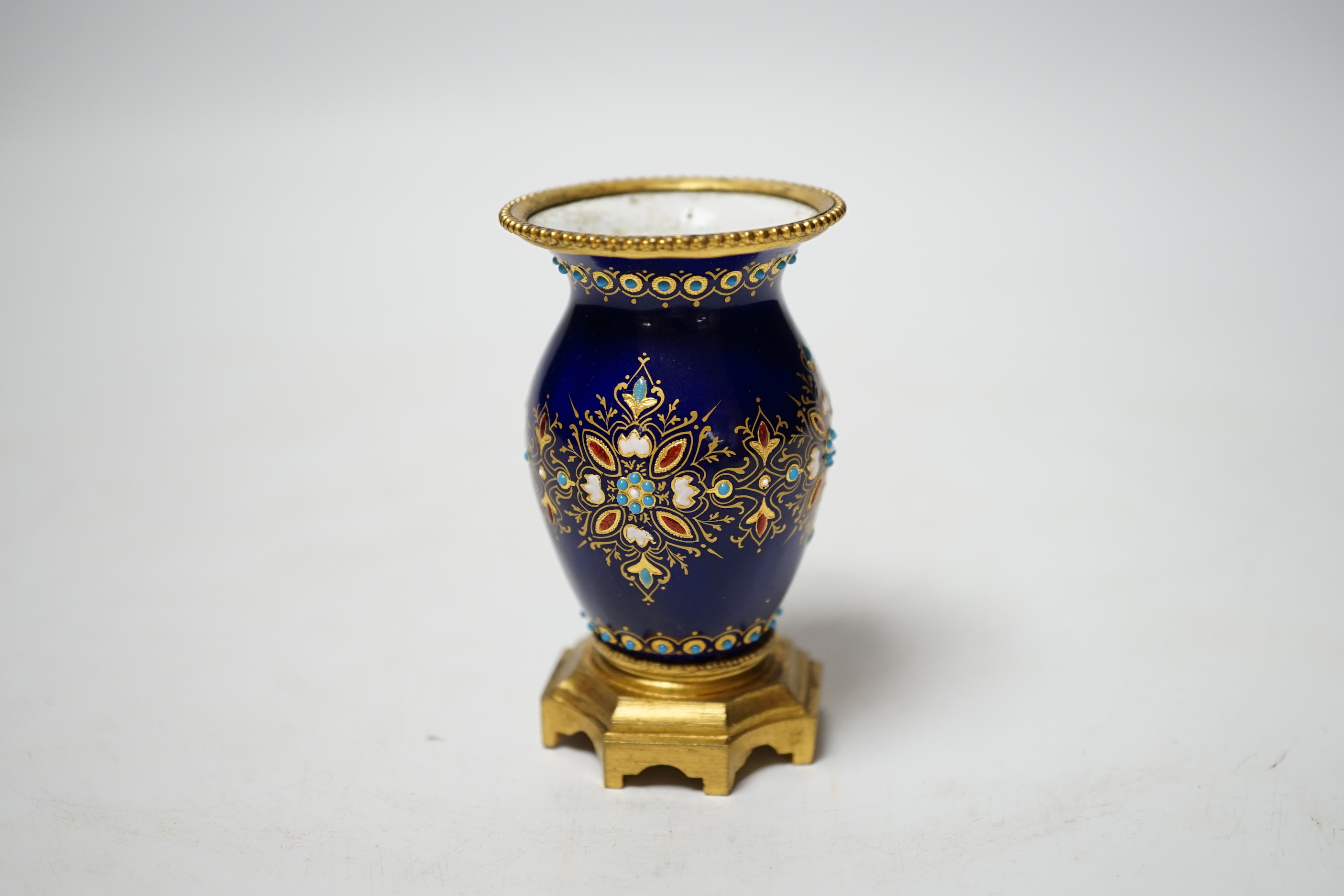 A small 19th century French jewelled blue enamel and ormolu vase, 8cm